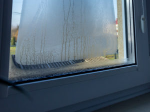 SWO Contracting - condensation on window illustrating moisture buildup issues.